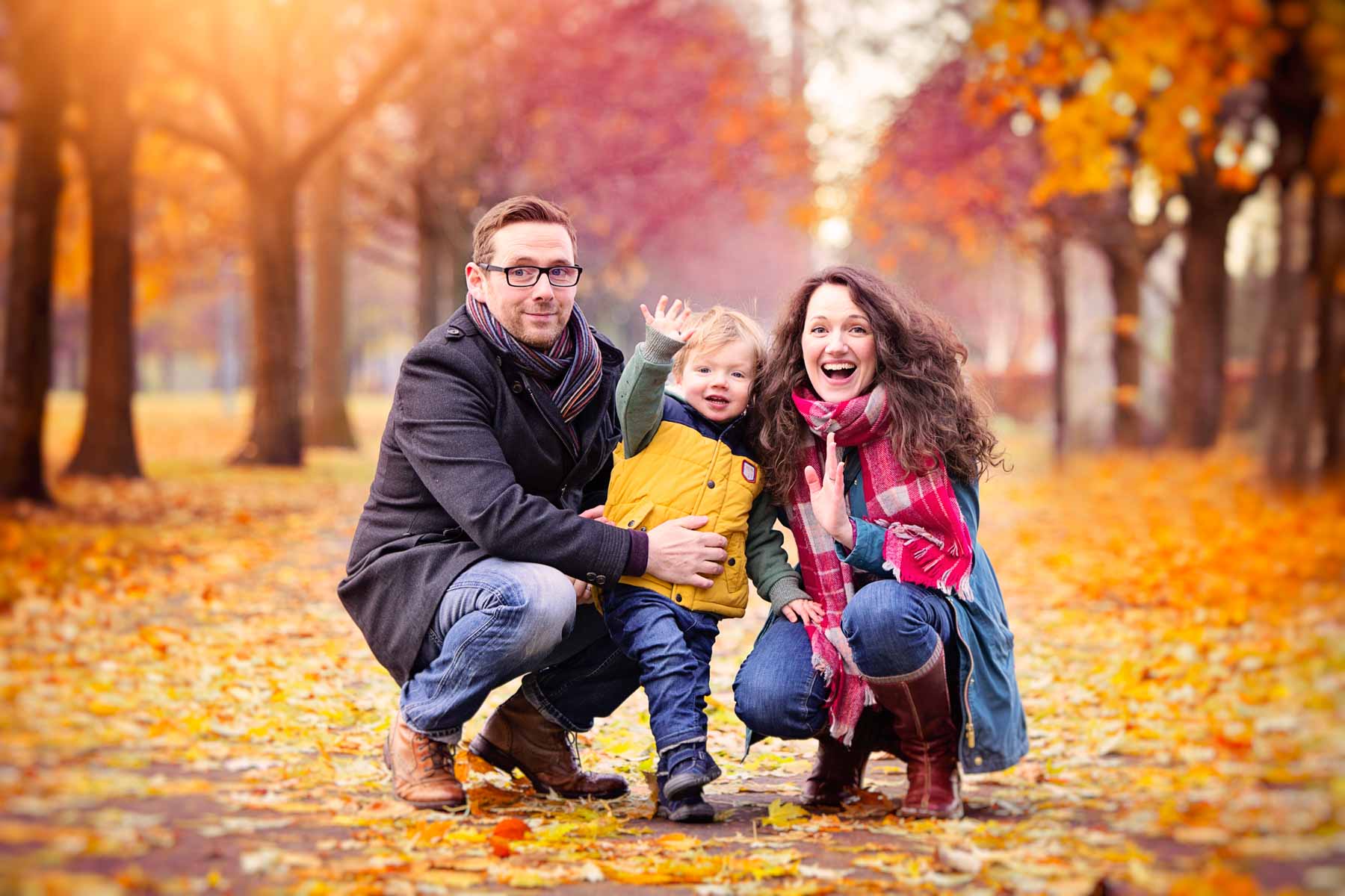 Family in autumn trees at Glasgow Green family photo shoot