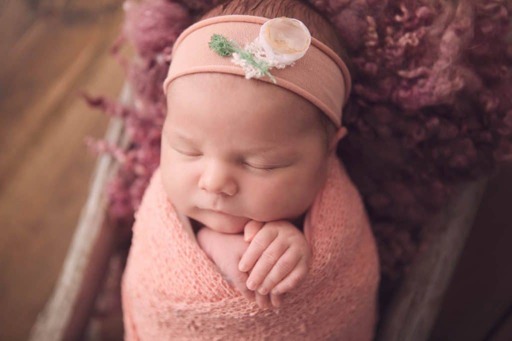 portrait image of newborn baby girl