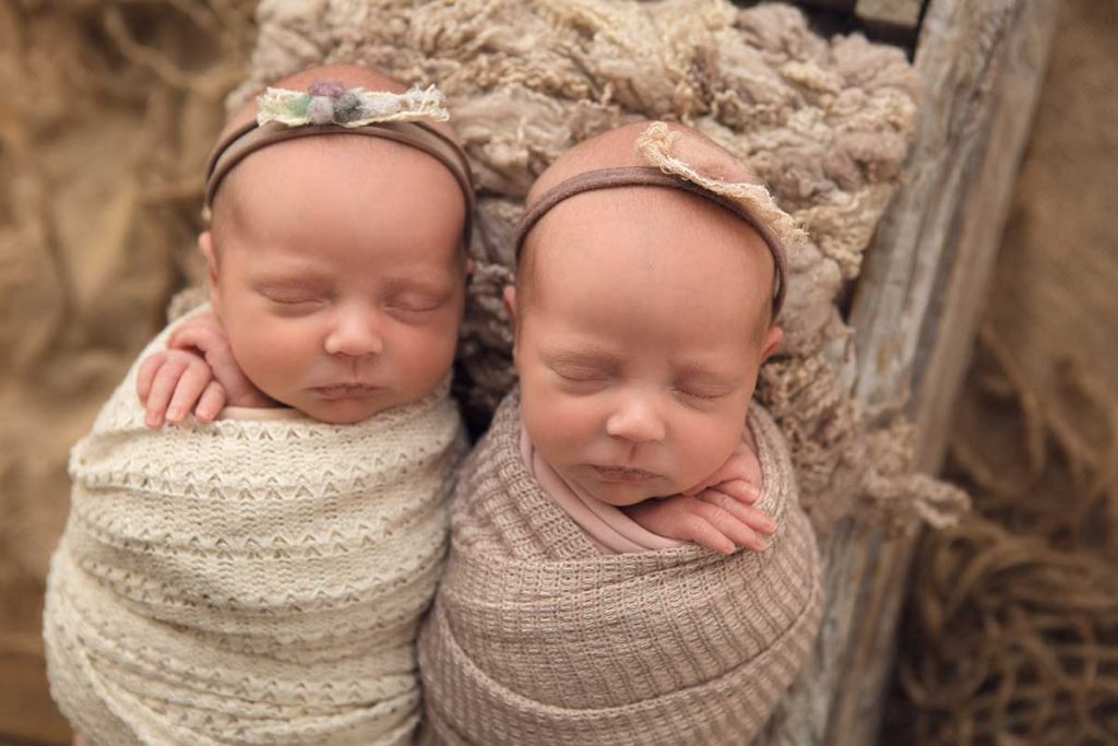 newborn sleeping twin girls