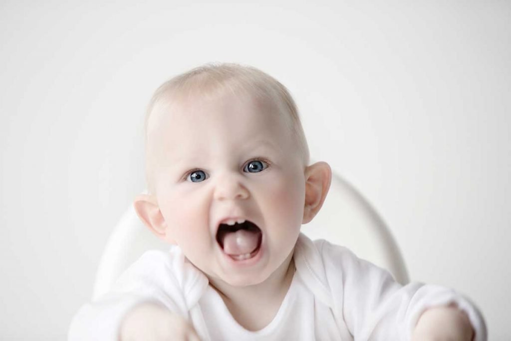 Baby laughing during baby photoshoot in Glasgow
