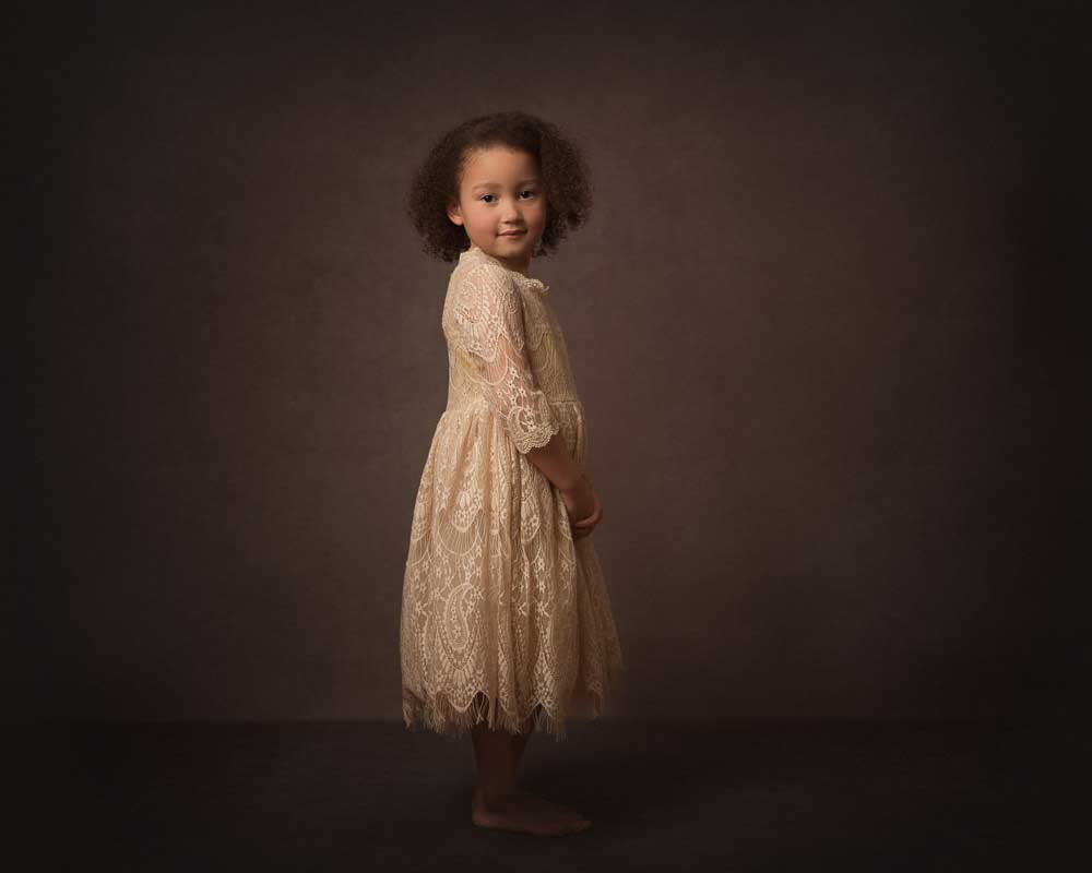 Fine Art Portrait of little girl in cream lace dress